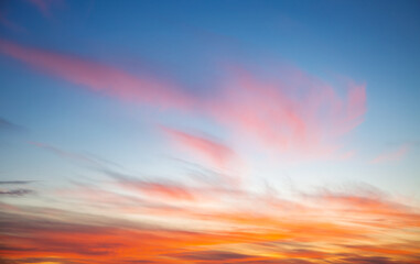 Fototapete - Utterly spectacular sunset with colorful clouds lit by the sun.