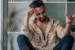 © carballo - young man with beard and casual outfit in the apartment