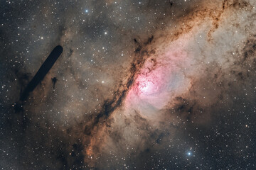 cosmic nebula image shows brown, pink, and white gas clouds with scattered stars, possibly represent