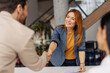 © Dusan Petkovic - Portrait of friendly female boss shaking hands with new team member on sprint meeting.
