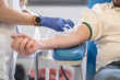 © LaMorenita - Anonymous hands of a nurse prepare the needle of the probe with which he will click his voluntary patient to donate blood. It is the blood bank of a hospital for health care
