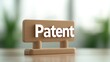 © Katawut - Wooden sign displaying the word Patent on a table A perfect image for intellectual property business concepts