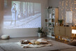 © Pixel-Shot - Living room with tasty snacks prepared for watching movie at home in evening