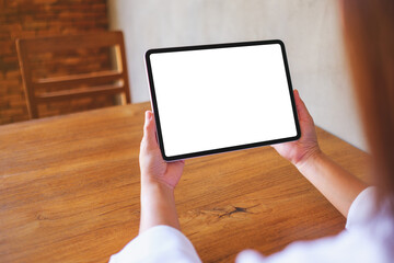 Wall Mural - mockup image of a woman holding digital tablet with blank white desktop screen