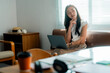 © Parichat - Young Asian Freelancer Woman Thinking and Working with Laptop at Home