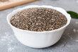© sosiukin - Chia seeds in bowl on colored background. Healthy Salvia hispanica in small bowl. Healthy superfood