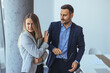 © Dragana Gordic - Businesswoman Rejecting Colleague's Advance in Professional Office Setting