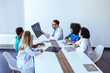 © Dragana Gordic - Medical Professionals Discussing Scan Results During a Team Meeting