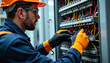 © AlenaSi - Electrician working on electrical panel indoors