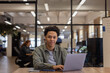 © ReeldealHD images - Portrait of a young employee with Laptop in an Office