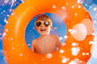 © Sunny studio - Happy child playing in waterpark. Kid having fun on summer vacation