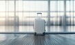 © Yevheniiya - A sleek suitcase waits on a moving walkway, ready for a journey in an airport terminal.