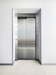 © ADDICTIVE STOCK - Modern stainless steel elevator door in a minimalist hallway