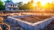 © AsjOne - Construction Site with Concrete Foundation and House Framing Under Bright Sunrise, Showcasing Early Stages of Building Development in a Residential Area