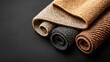 © Maksym - Floor Rugs Rolled on Black Surface, Textured and Colorful