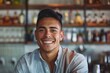 © CojanAI - Smiling portrait of a young Hispanic male bartender in a modern bar