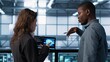 © DC Studio - Software developers in data center use AI technology on tablet to optimize storage volumes. IT specialists in server hub facility using artificial intelligence to ensure seamless operations, camera A