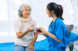 © ArLawKa - Asian female doctor consulting elderly patient at home, explaining diagnosis and treatment plan, providing health care to elderly woman, medical health concept