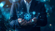© Mutshino_Artwork - Businessman holding glowing digital gear icon representing automation and innovation