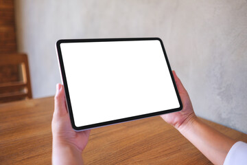 Wall Mural - mockup image of a woman holding digital tablet with blank desktop screen