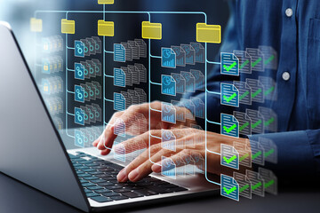 Fototapete - Document management system DMS. Folder structure and classification system. File and folder icons. Businessman using laptop computer for controlling document versions.