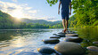 © SAN - Tranquil Steps Man Walks on River Stones at Sunset in Nature Serene Scene Outdoors Exploring Peace