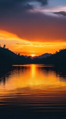 Fototapete - Breathtaking sunset over a serene lake with the sky ablaze in shades of orange yellow and purple that are beautifully reflected on the calm waters