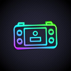 Wall Mural - glowing neon line portable video game console icon isolated on black background. handheld console ga