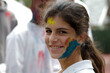 © RooM The Agency - Portrait of a Smiling teenage girl covered in paint (gulal) at the Holi Festival, India