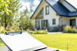 © Bnz - Close-up of blank clipboard on outdoor table with blurred house in background surrounded by greenery in bright daylight. Concept of real estate inspection, home evaluation and property checklist.