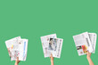 © Pixel-Shot - Women with newspapers on green background