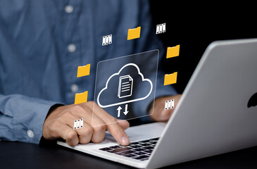Businessman using computer laptop and dashboard for data management with computer showcasing a cloud-based documentation system for efficient digital file storage,online documentation technology