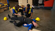 © Wosunan - A group of warehouse workers were involved in an accident while on duty, Coworkers offered assistance and first aid
