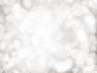 Background grey bokeh abstarct white beige circle light texture bubble blur pattern defocused glowing sparkle snow glitter snowflake magig backdrop ecosystem foreground card silver space decoration.