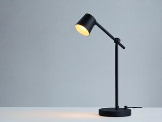Poster - Contemporary black table lamp placed on a white table, providing stylish lighting and enhancing home decor