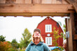 © Johnér - Happy young man looking at construction frame with mother