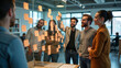 © Eduardo Accorinti - Businesspeople collaborating in modern office, using sticky notes on glass task board during meeting focused on innovative ideas, young adult men and women organizing workflow in brainstorming session