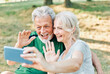 © Lumos sp - woman man outdoor senior couple happy lifestyle retirement together love elderly video call selfie photo mobile smartphone communication phone sport active fitness outfit training healthy