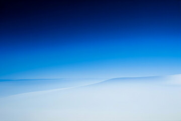 Wall Mural - a smooth gradient from deep to light blue
