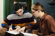 © DragonImages - Businesswoman examining cv of young job candidate at their meeting in office