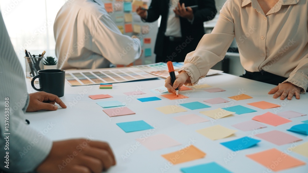 A dynamic scene of a team engaging in a brainstorming session using ...