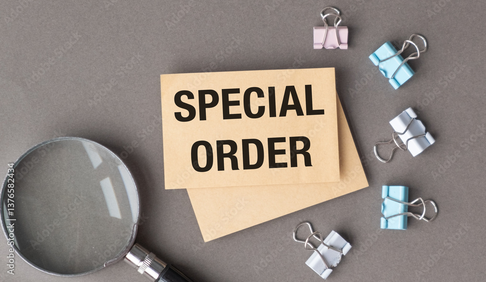 A magnifying glass is on top of a piece of paper that says Special Order