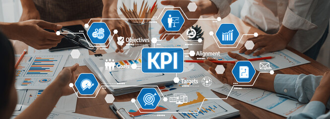 Poster - A dynamic business meeting focusing on key performance indicators, showcasing hands engaged with charts and documents on the table for effective decision-making. Amity