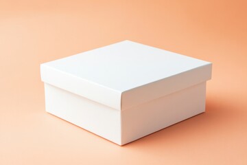 Fototapete - Clean, empty white box on a soft orange background ideal for storage or gifting purposes
