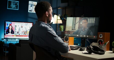 Wall Mural - black remote worker meeting with his team leader via video conference call, sharing ideas and insigh