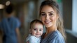 © Yuliia - Young Caucasian mother with blonde hair holding smiling baby in grey casual clothing against blurred background, genuine emotional connection and tender moment between parent and child.