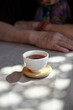 © ChaoShu Li/Stocksy - Closeup of tea cup and tea, traditional Chinese morning tea