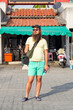 © Studio KME/Stocksy - Tourist in Front of Traditional Thai Market