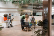 © VICTOR TORRES/Stocksy - Modern workspace with collaborative business meeting and teamwork