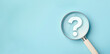 © LAONG - International ask a question day concept, Magnifying glass focused on question mark, Answer, Q&A, Communication and Brainstorming